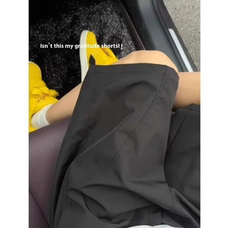 Men's quick-dry polyester sports shorts in straight-leg style with elastic waistband