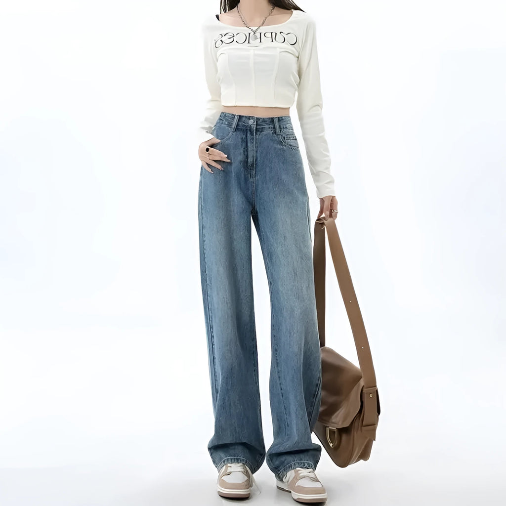 Woman wearing retro blue high-waisted wide-leg denim jeans with a straight-leg cut.