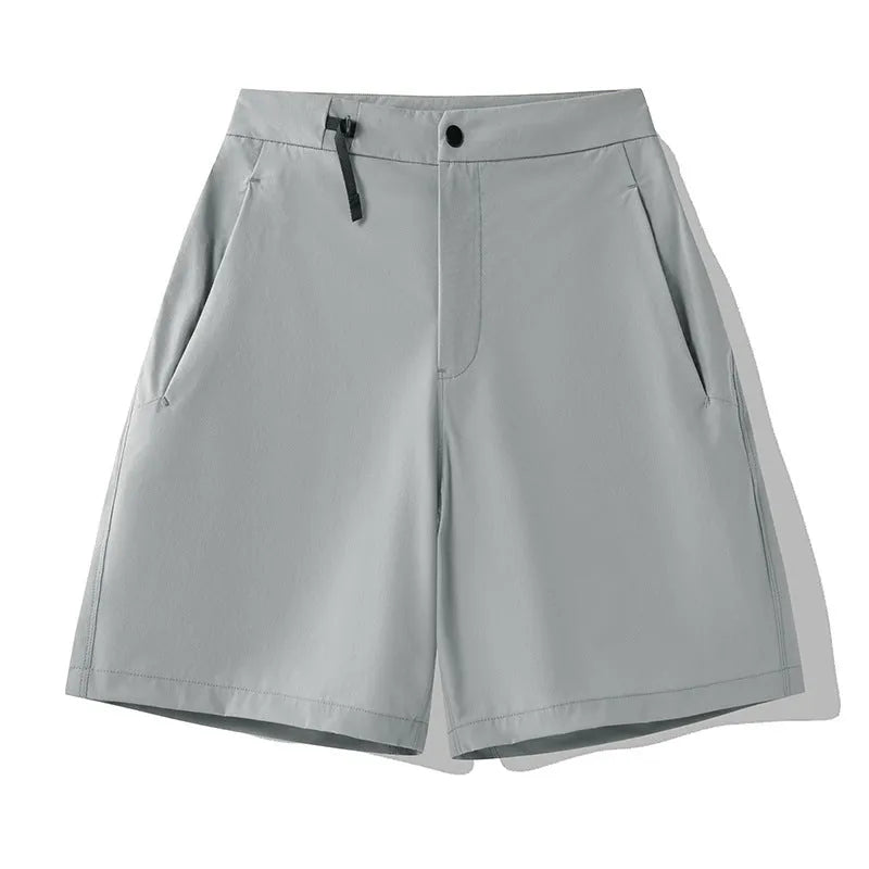 Men's khaki quick-dry sports shorts with 3D cut and four-way stretch fabric for athletic movement.