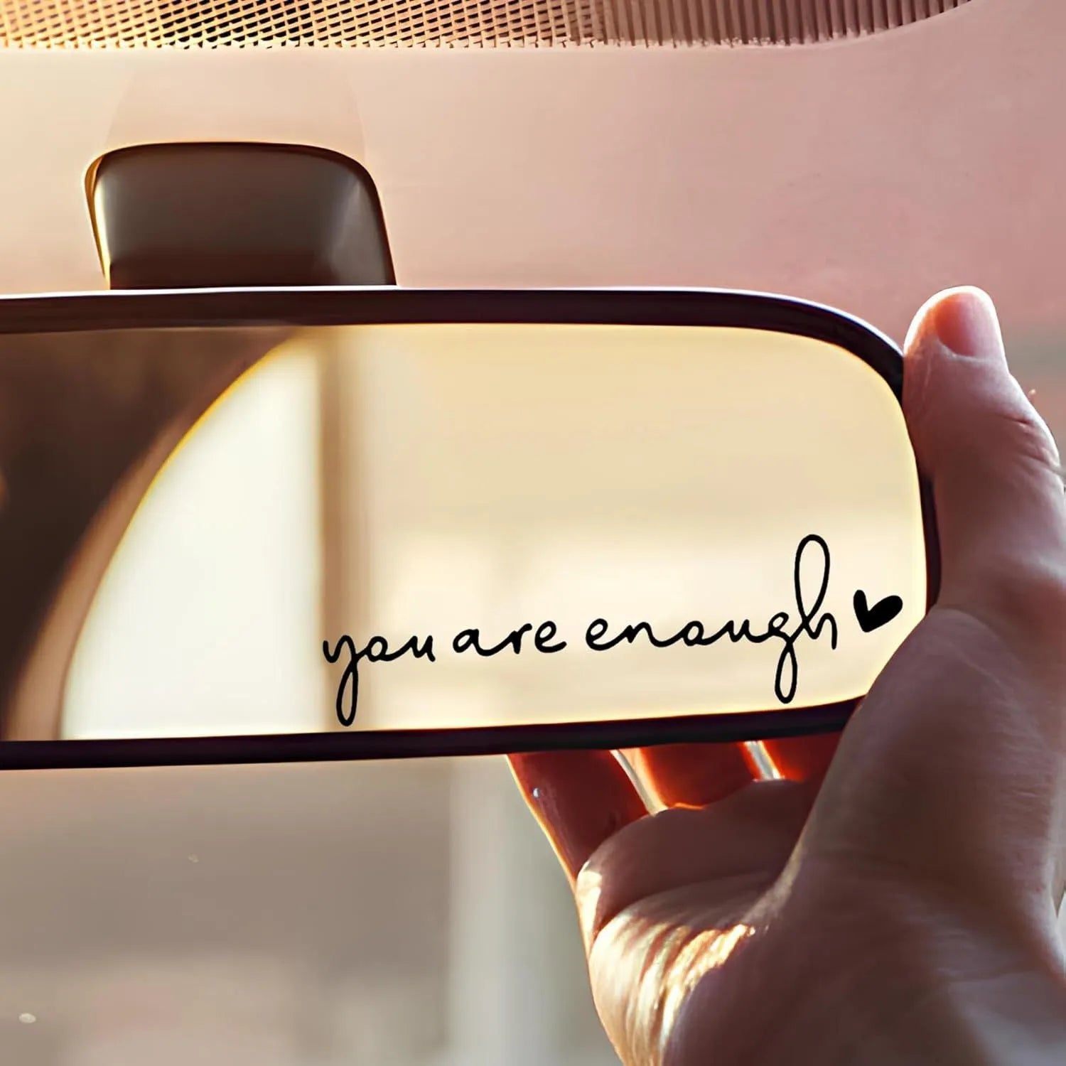 Plastic rearview mirror sticker 10x3cm in black on a car mirror