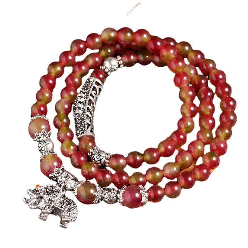 Handmade watermelon crystal bracelet with Chinese knot in 8mm or 6mm elephant style beads.