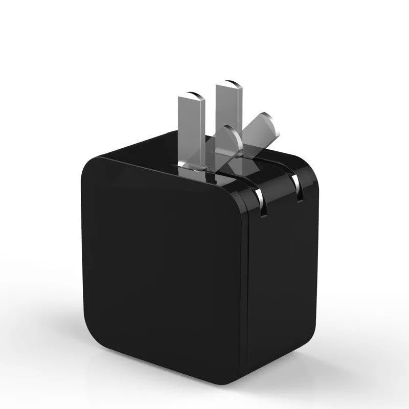 Black 5V2.4A dual USB fast charger with digital voltage display plugged into UK wall socket