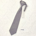 A navy blue cotton men's bow tie with an arrow style design on a white background.