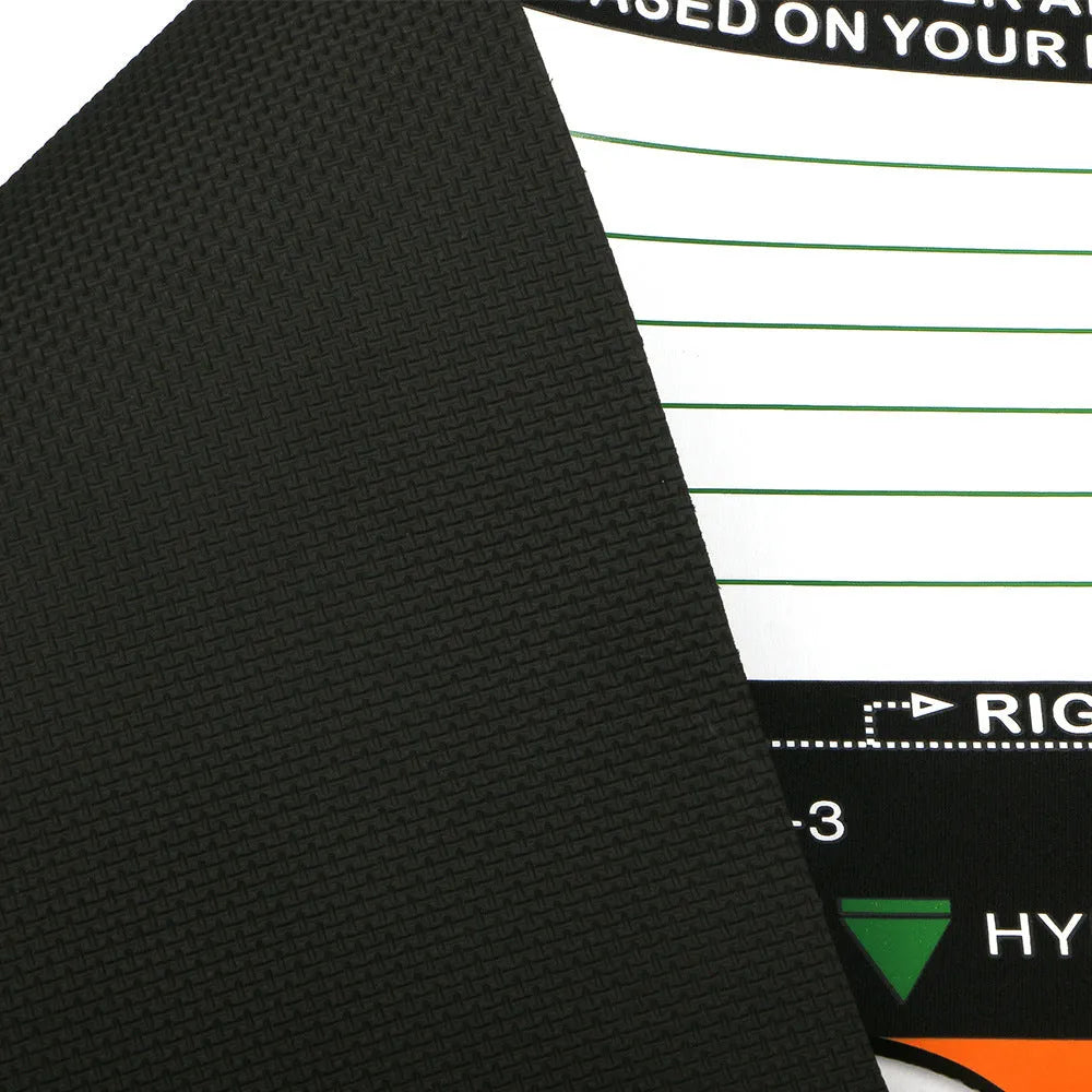 Black neoprene golf swing stance correction pad on grass