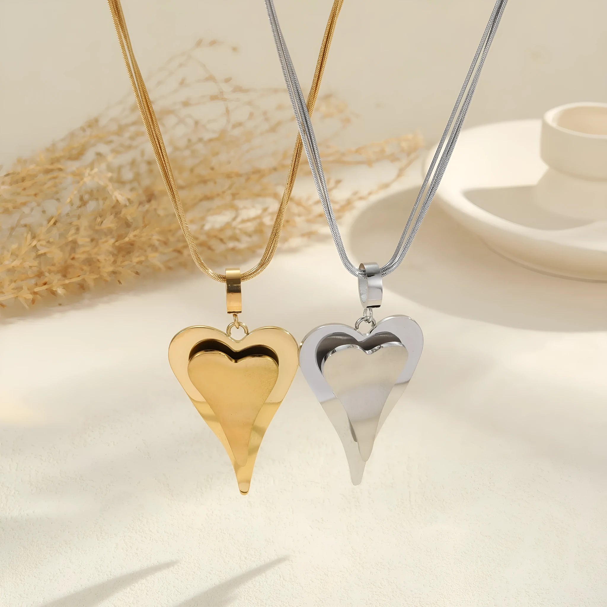 Double heart snake bones chain necklace with geometric pendant in stainless steel with 18K electroplated finish