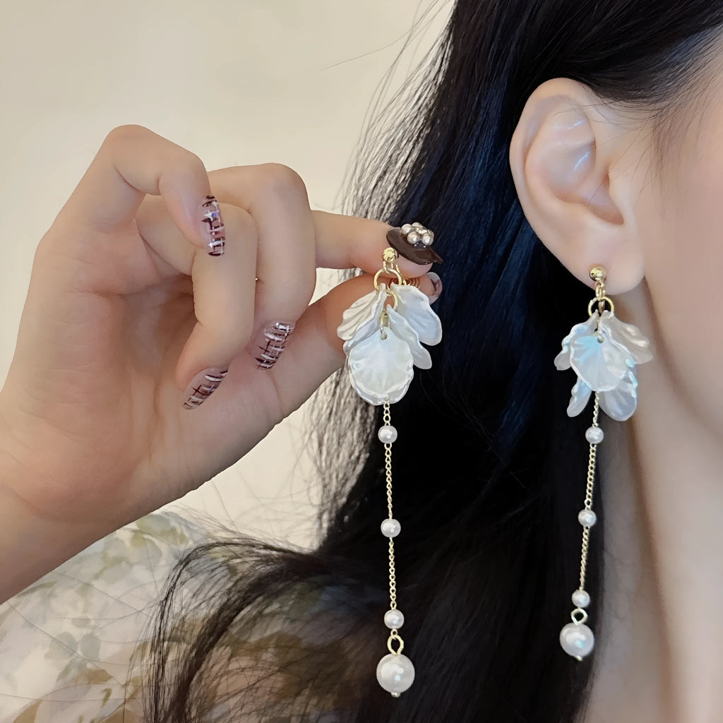 Women's acrylic shell pearl tassel earrings with 8.8cm drop length showing four different clip style options