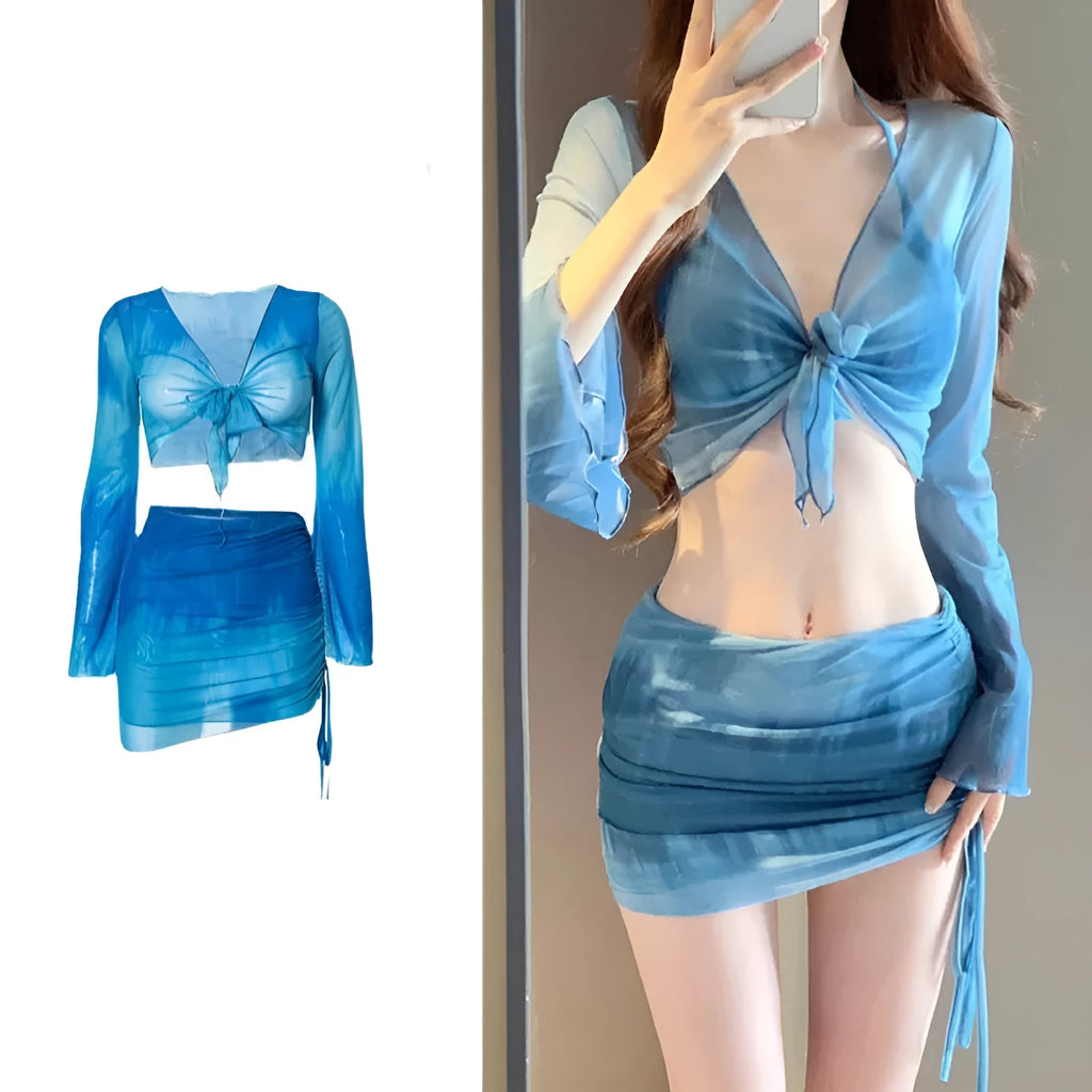 Women's blue high-waisted bikini four-piece swimsuit set with shirt, bra, underwear, and skirt for beach wear
