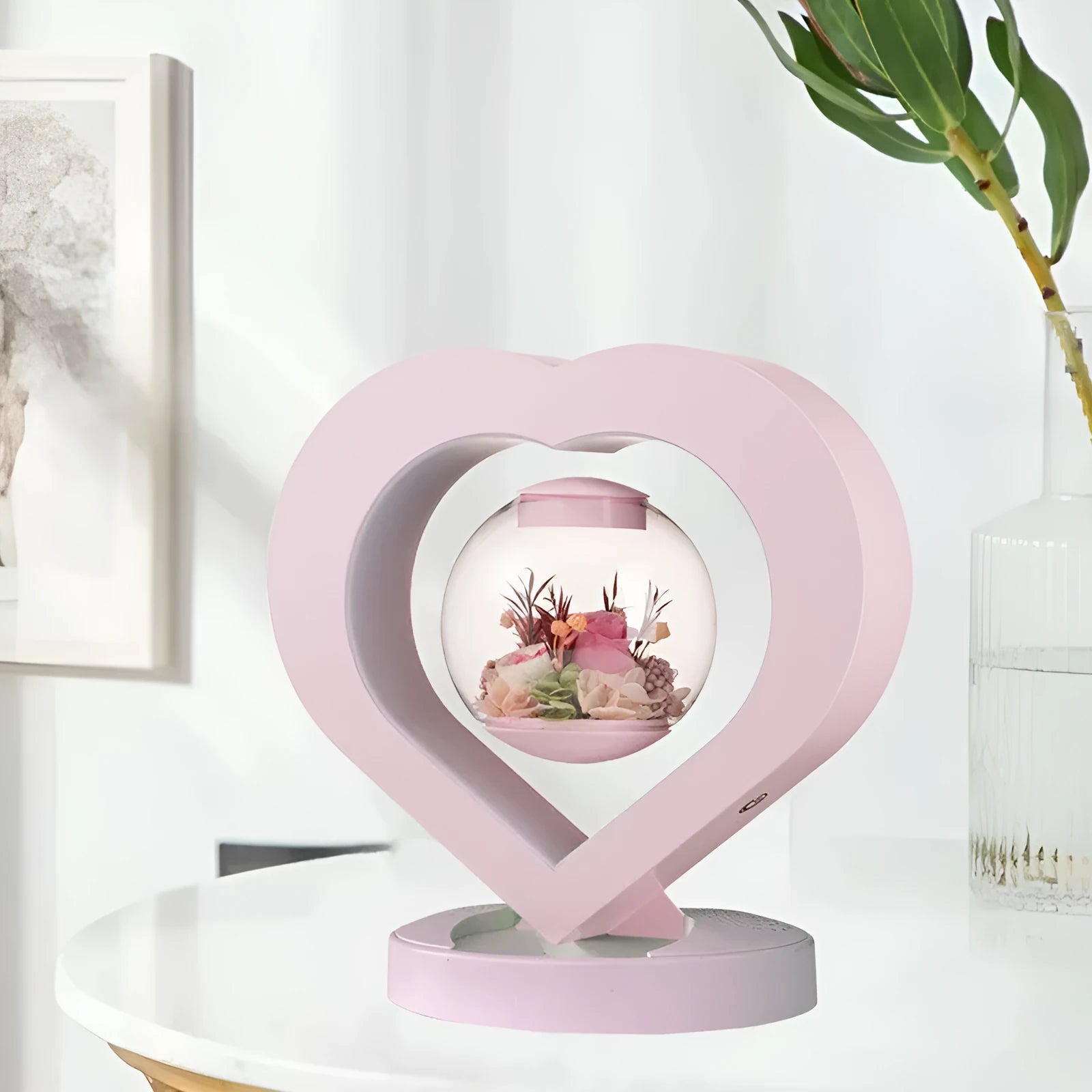 Pink preserved rose ornament with LED lights on a base, with optional audio Bluetooth for music.