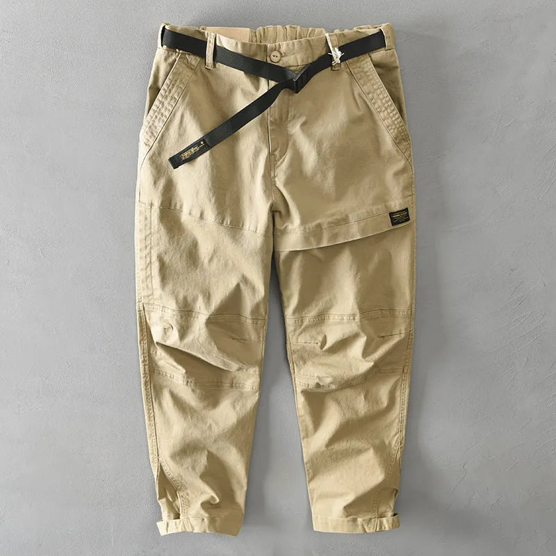 Man wearing khaki cotton elastic casual Japanese overalls with a loose fit.