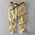 Man wearing khaki cotton elastic casual Japanese overalls with a loose fit.