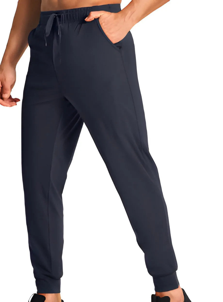 Men's loose fit casual trousers in solid colour polyester fabric showing relaxed cut and casual styling