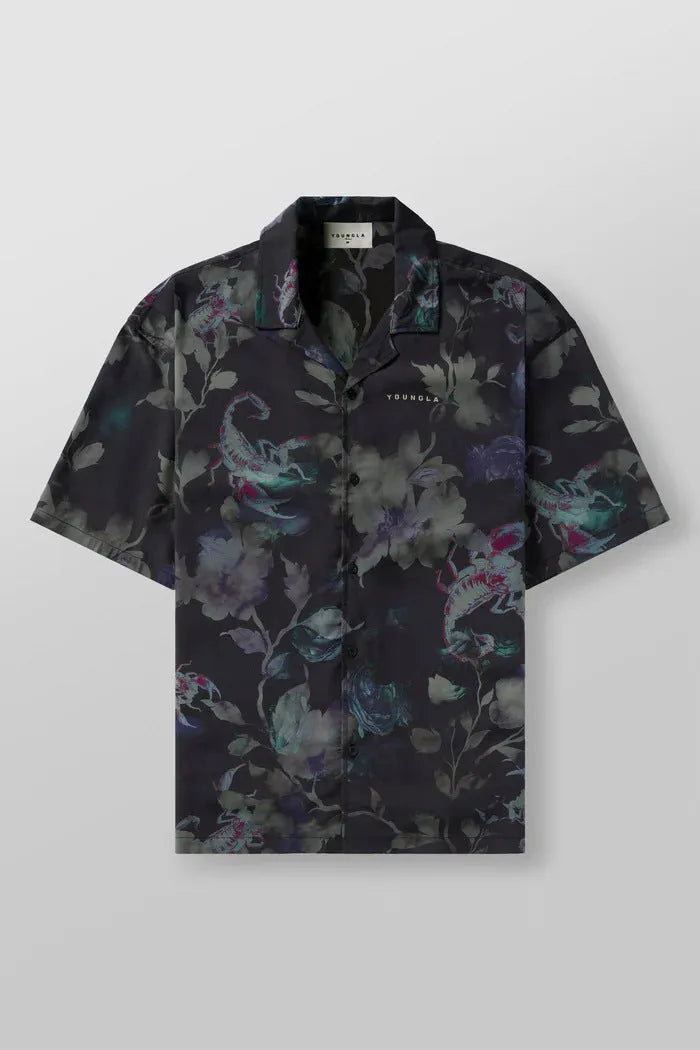 Men's loose-fit short sleeve top with floral print in light colour, laid flat.
