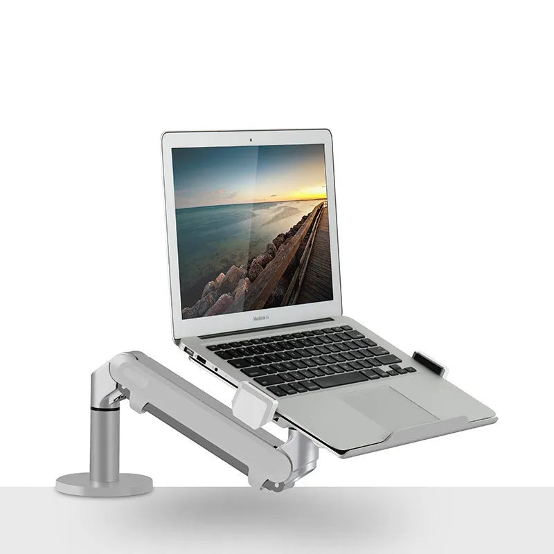 Silver aluminium laptop stand with an adjustable air-pressure arm holding a notebook
