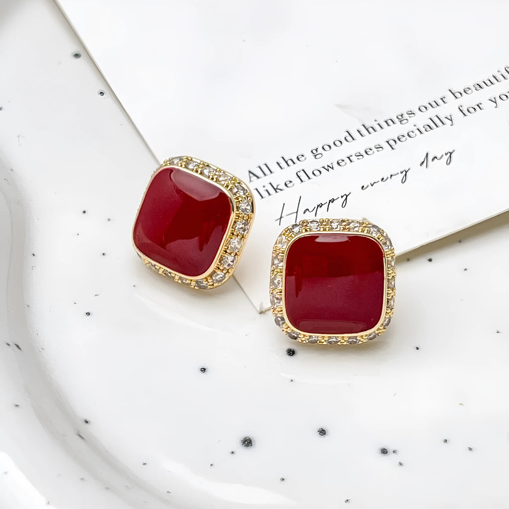Red geometric square alloy earrings with clip-on fastening and embedded square design elements