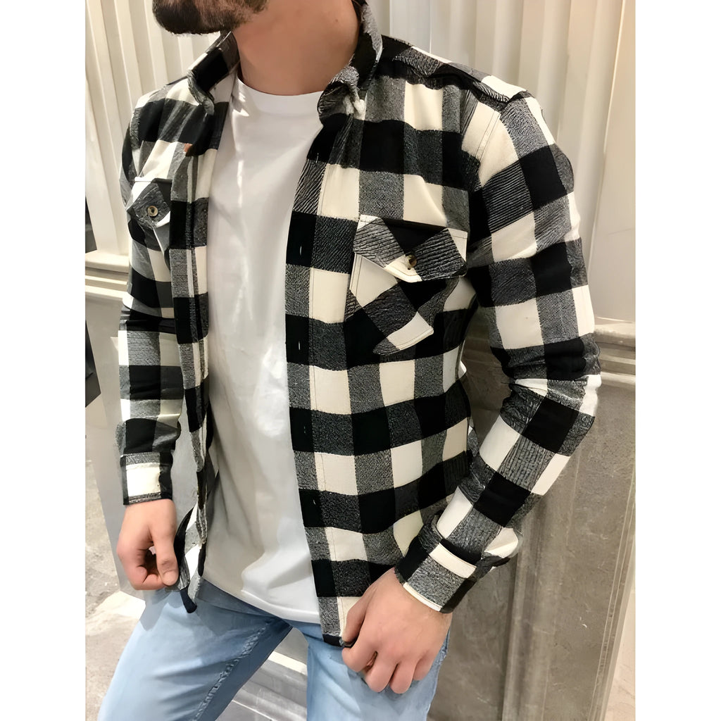 Men's long-sleeved black and white checked shirt with lapel collar and double chest pockets, front view.