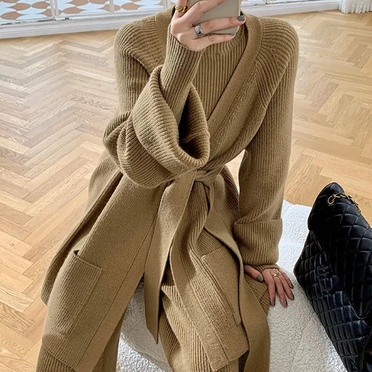 Women's apricot knitted three-piece set showing wide-leg trousers, V-neck top, and longline cardigan with leather stitching.