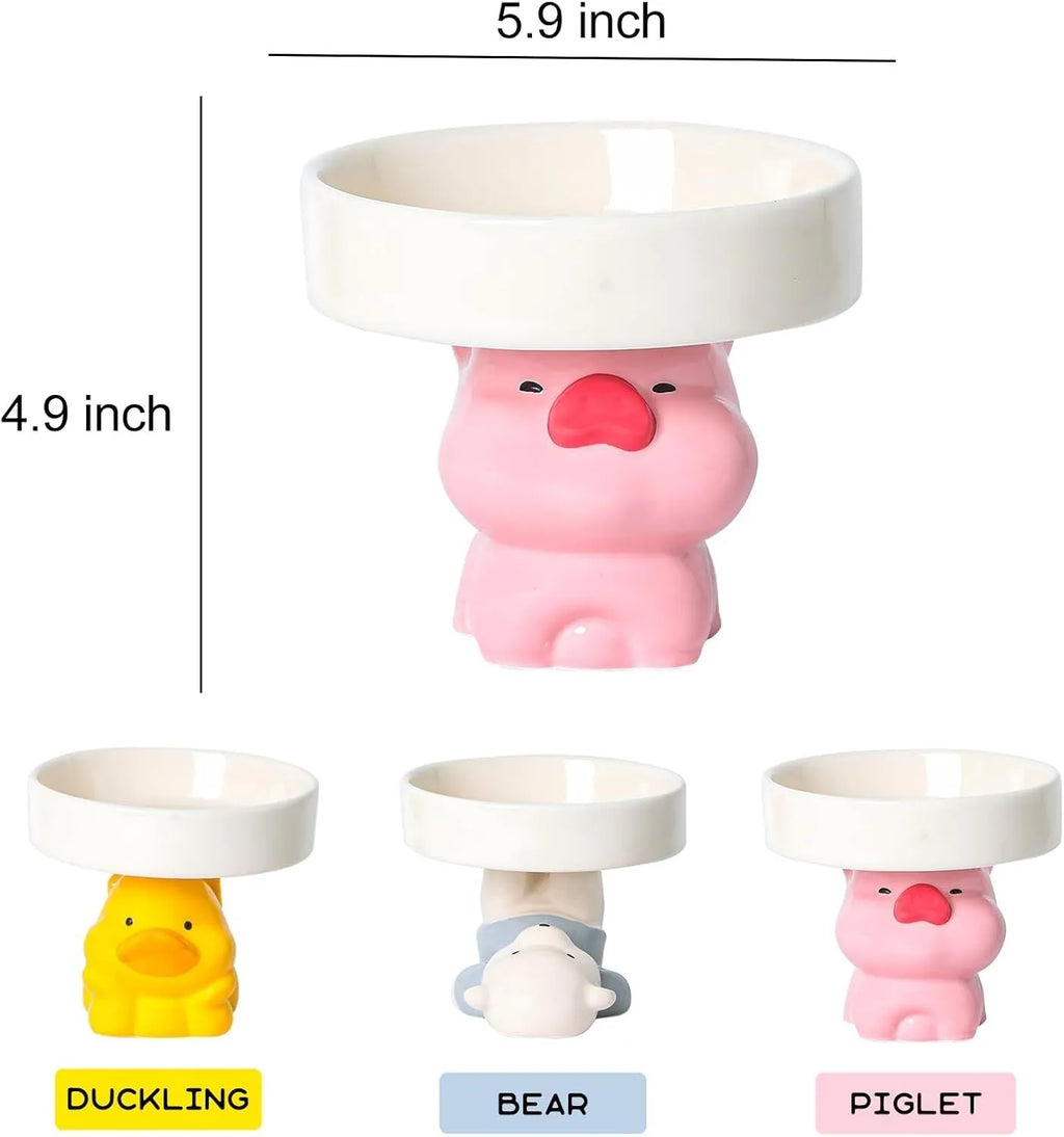 Raised ceramic pet bowl in animal design, showing wide shallow dish on elevated base.