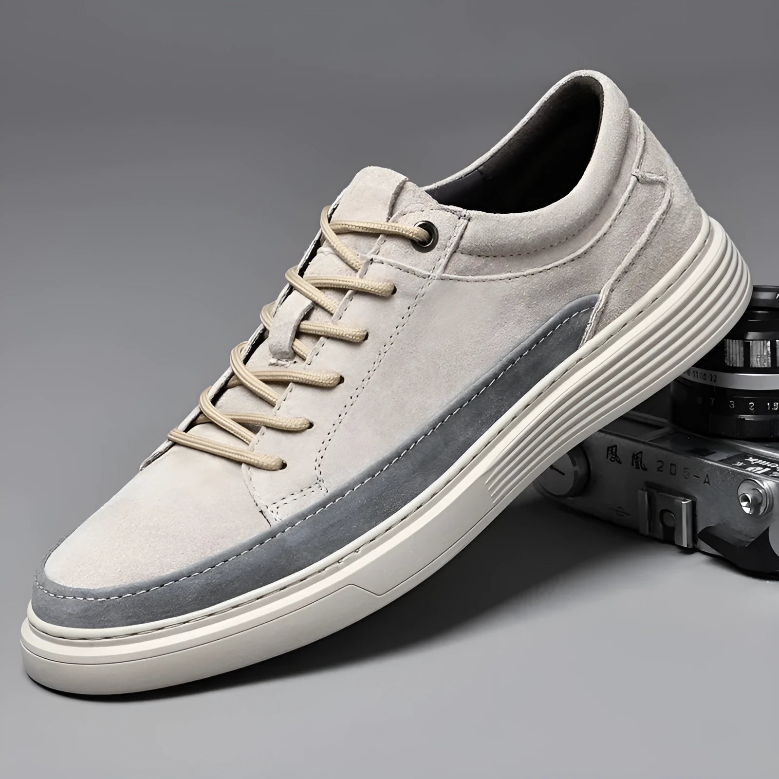 Men's grey casual leather skate shoes with low-top design and round toe on a rubber sole.