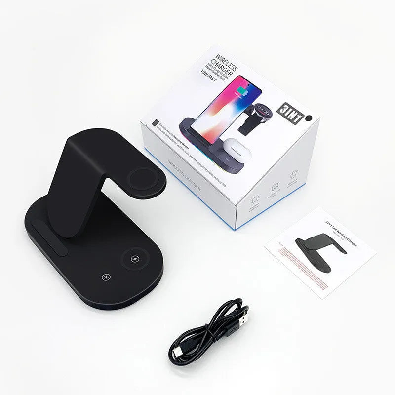 Black three-in-one wireless charging station with phone, watch and accessory on charging surfaces