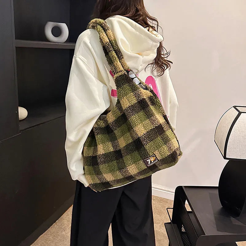 Women's plaid plush crossbody tote bag showing large capacity interior with zipper compartments