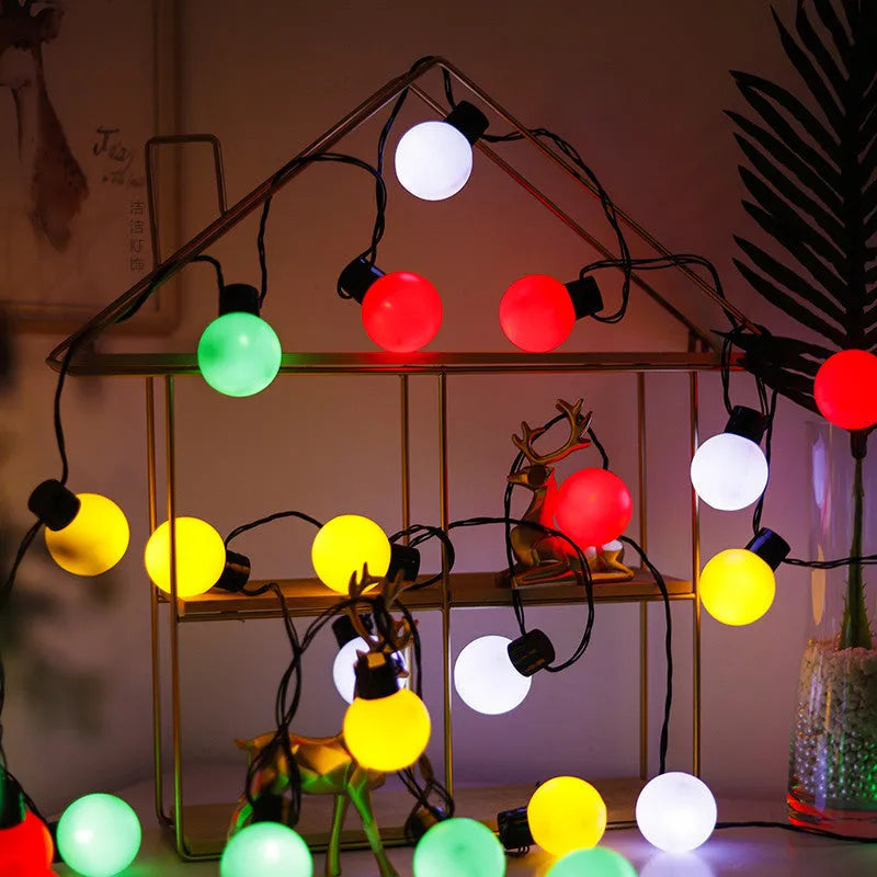 10 metre solar powered decorative festoon lights with 40 LED bulbs for festival tents in black with warm white LEDs