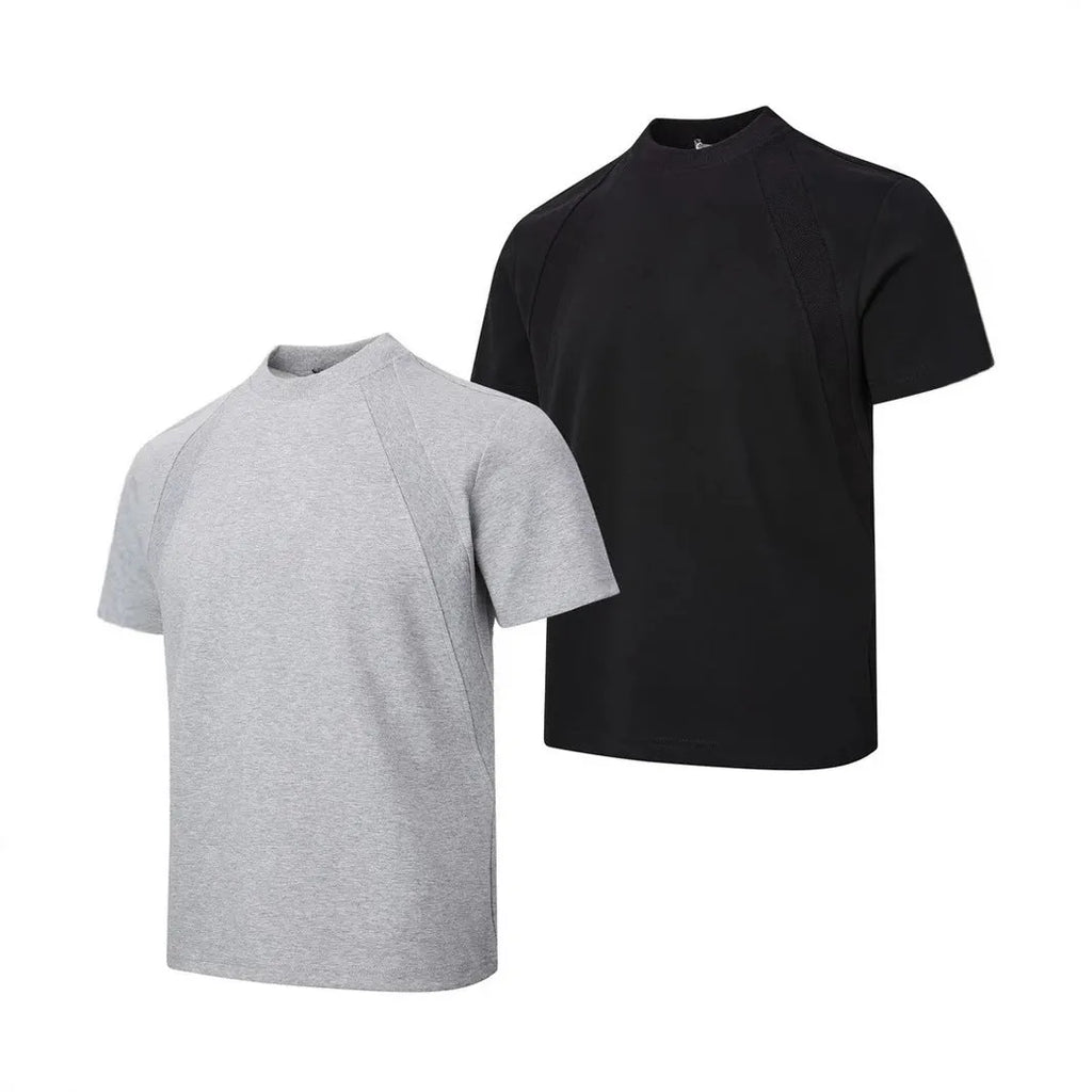 Men's loose fit short sleeve top in black with air layer stitching detail on a grey background.