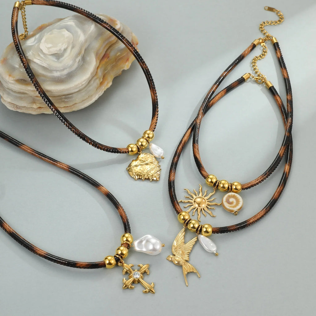 Geometric leopard head stainless steel necklace with gold electroplated finish on adjustable chain