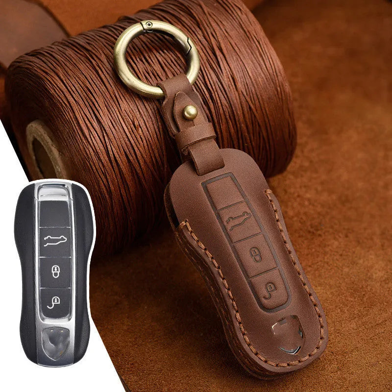 Porsche leather key cover with retro bag buckle in blue and brown colour options