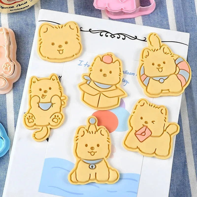 Three-dimensional plastic biscuit mould set with puppy cartoon designs including birthday hats and swimming rings