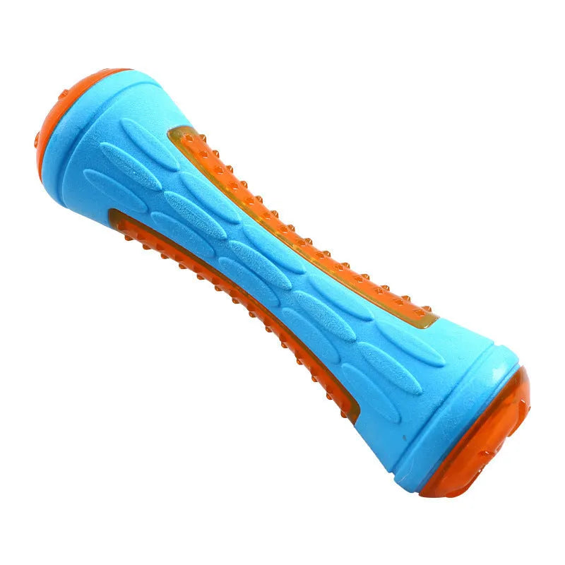 Set of three TPR dog toys: a red ball, a blue barbell, and an orange tire, floating in water.