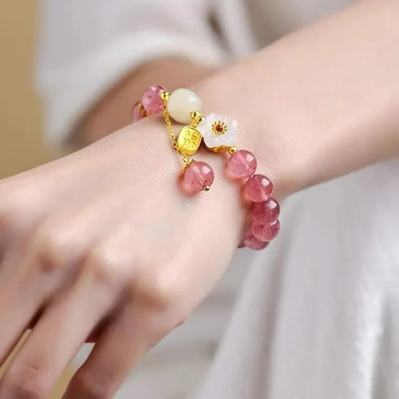 Handmade women's bracelet with Hetian jade and strawberry quartz crystals in peach blossom design