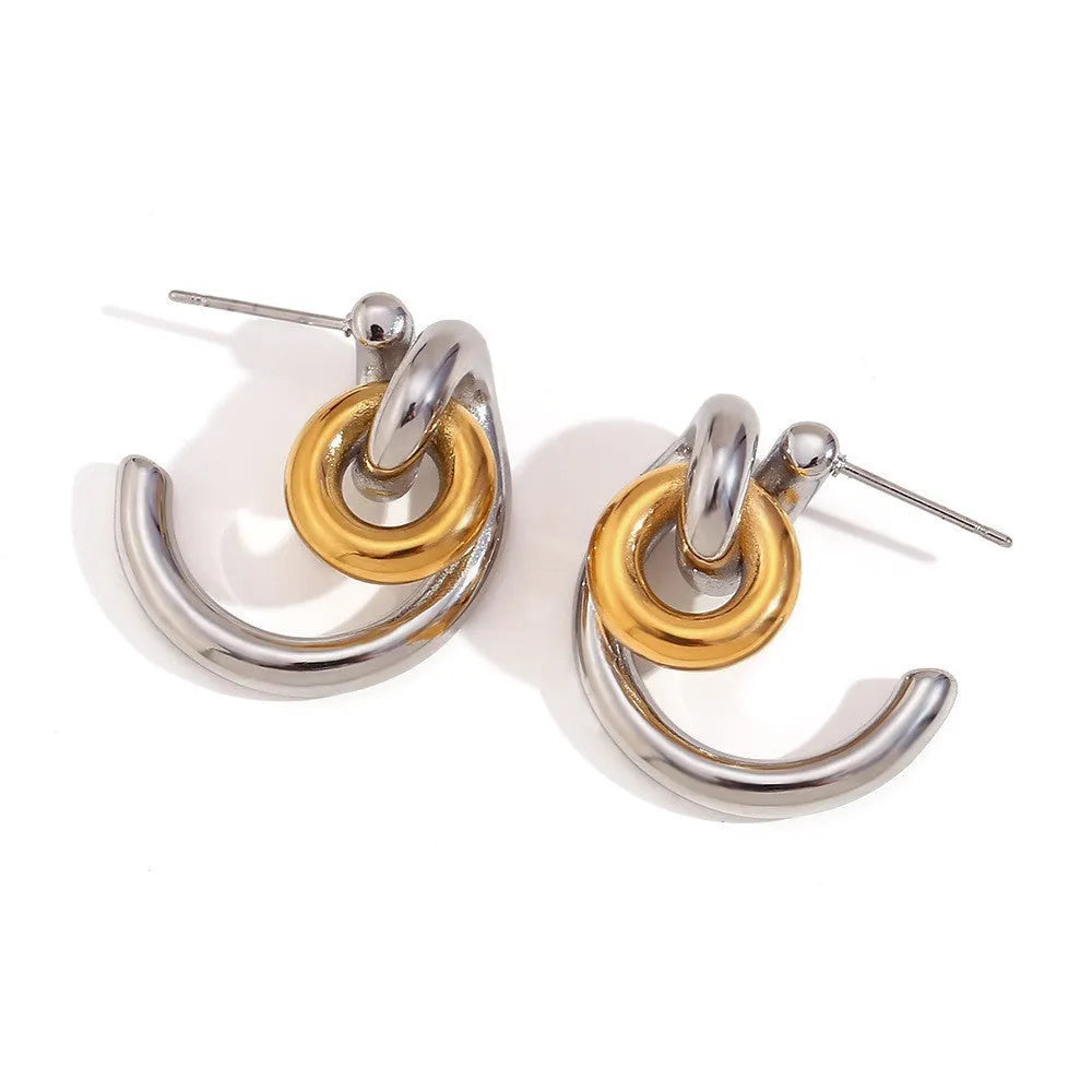 Gold geometric stainless steel jewellery set for women, showing earrings, necklace, and bracelet with electroplated finish.