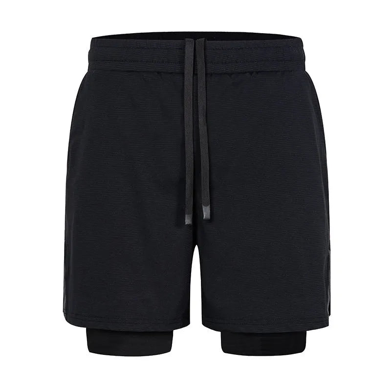 Man wearing quick-drying plaid sports shorts in army green, showing mid waist and shorts length.