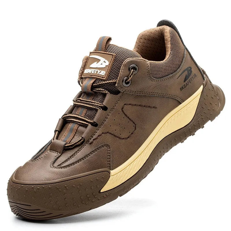 A pair of Flyknit safety work shoes with a leather upper and rubber sole, shown in a neutral colour.