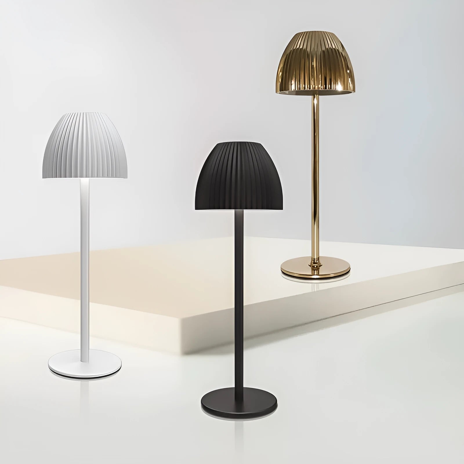 Modern dimmable night lamp with circular base in black or white colour options