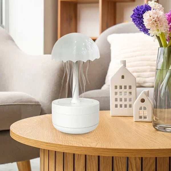White jellyfish design humidifier diffuser with colourful night lights on desk