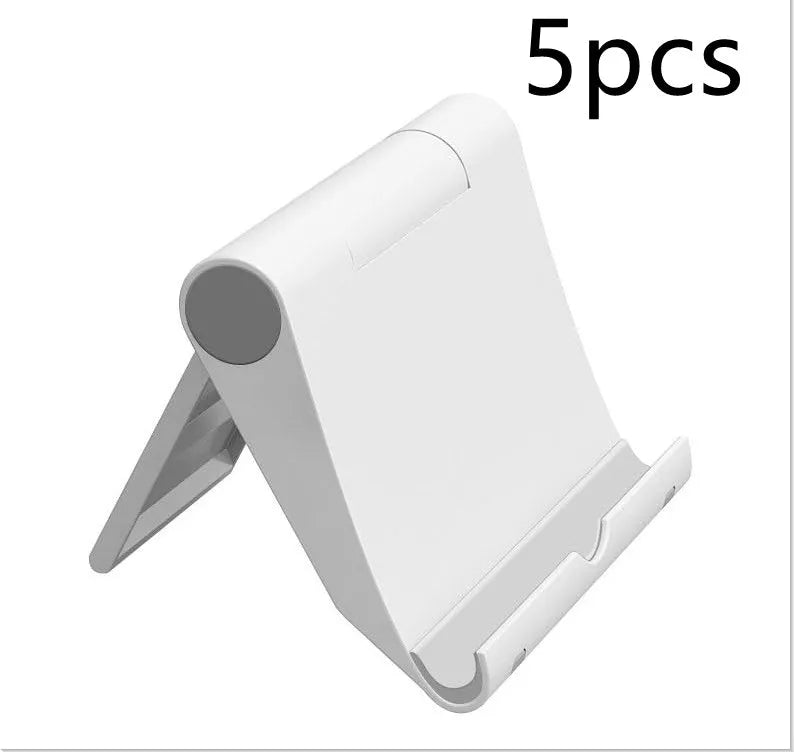 Black PE folding tablet stand holding a mobile phone at an adjustable viewing angle on a wooden desk.