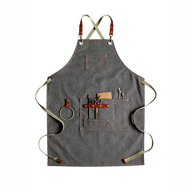 Canvas apron with cross-back straps in camel colour