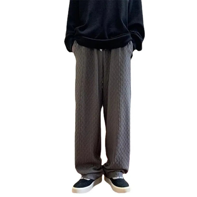 Men's jacquard rhombus draped pants in black, long straight-leg polyester blend trousers with non-ironing finish.