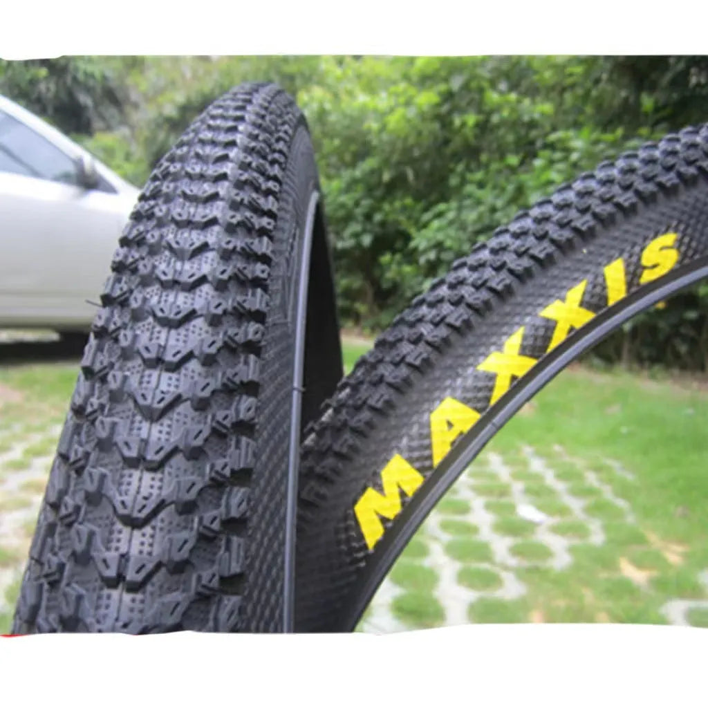Ultralight mountain bike tyre with puncture-resistant tread, shown in a black and white sidewall style.