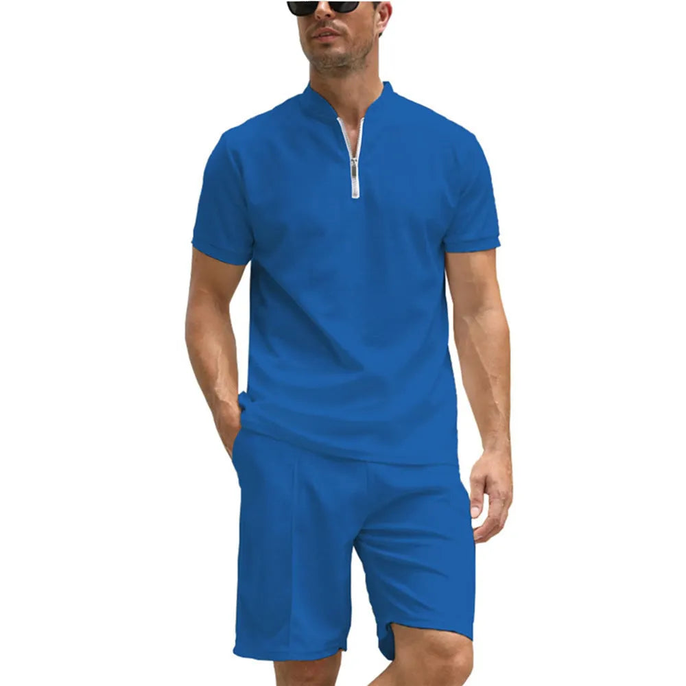 Men's solid colour polo shirt and trouser two-piece set in textured fabric.