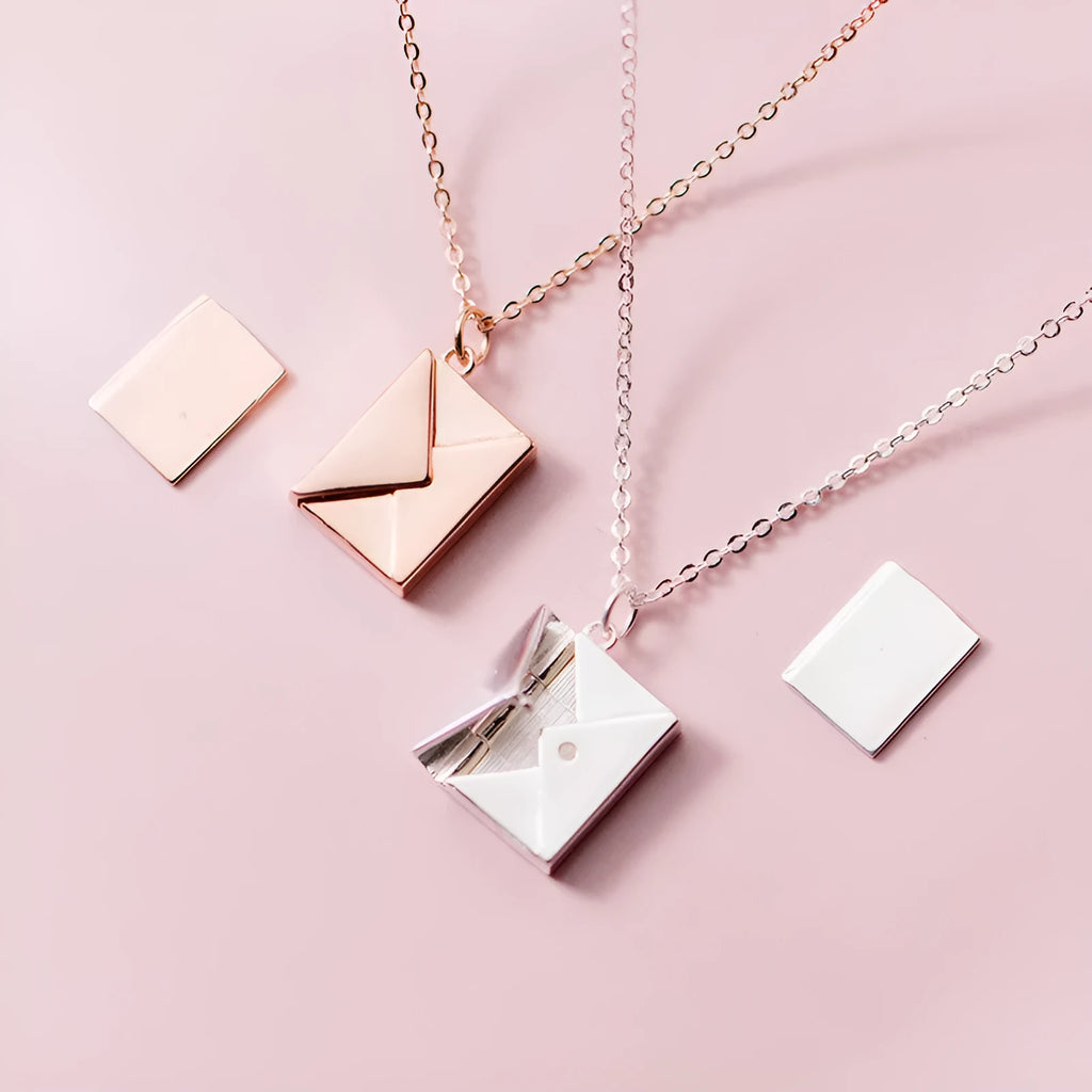 Titanium steel envelope pendant necklace with chain on a woman's neck, gold finish