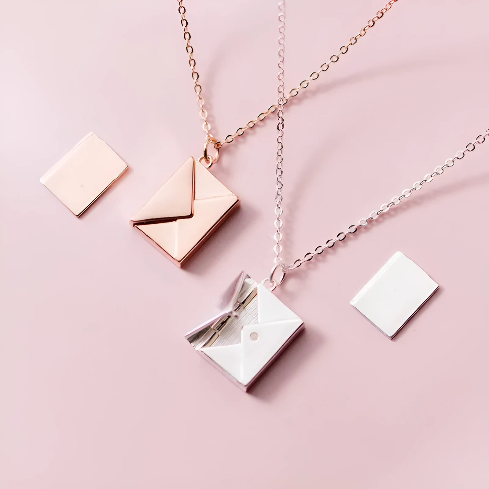 Titanium steel envelope pendant necklace with chain on a woman's neck, gold finish