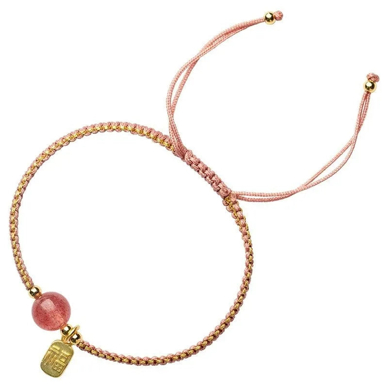 Adjustable red rope bracelet with a choice of Strawberry Quartz or Hetian Jade bead, showing the national style design.
