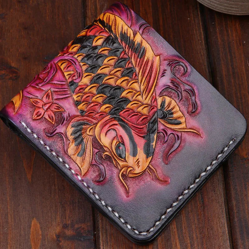 Men's blue hand-carved leather bifold wallet showing card slots and note compartment, placed on a wooden surface.