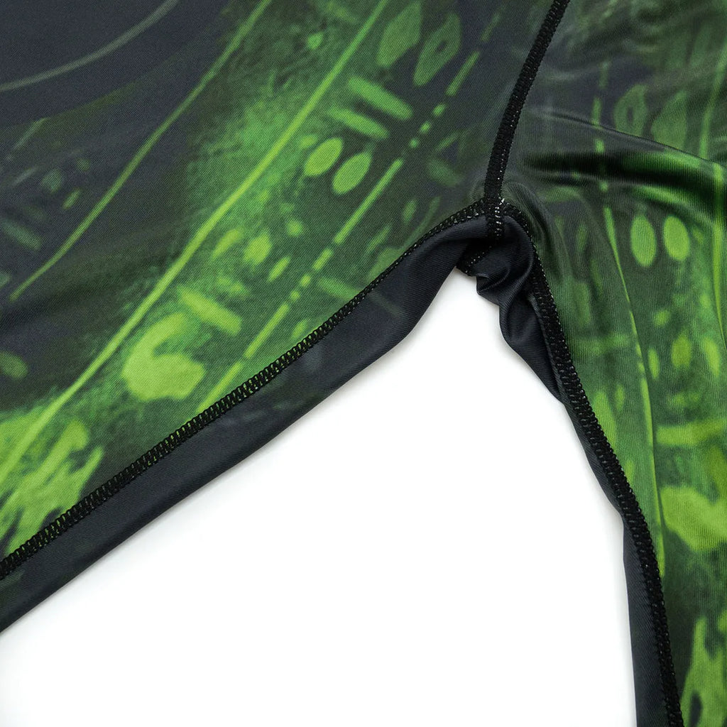 Men's slim-fit long sleeve sports top and trousers set in dark colour for outdoor fitness.