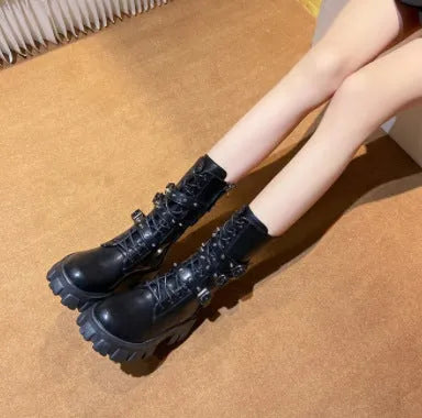 Women's black mid-calf buckle knight boots with side zipper on a white background.