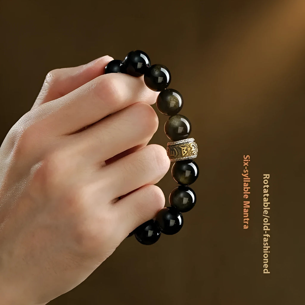 Hand-carved cinnabar bead bracelet with Jinniu zodiac design in gold obsidian colour