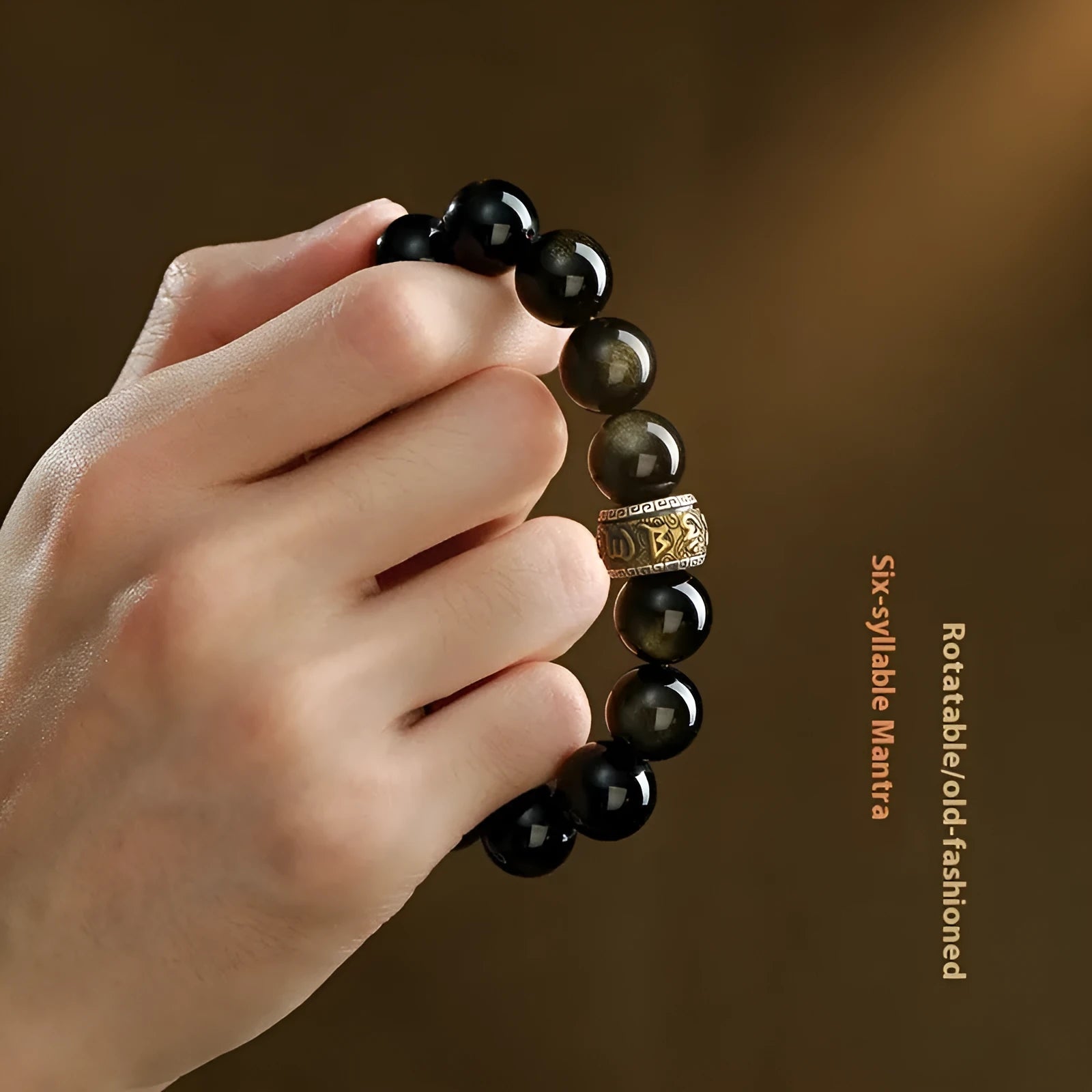 Hand-carved cinnabar bead bracelet with Jinniu zodiac design in gold obsidian colour