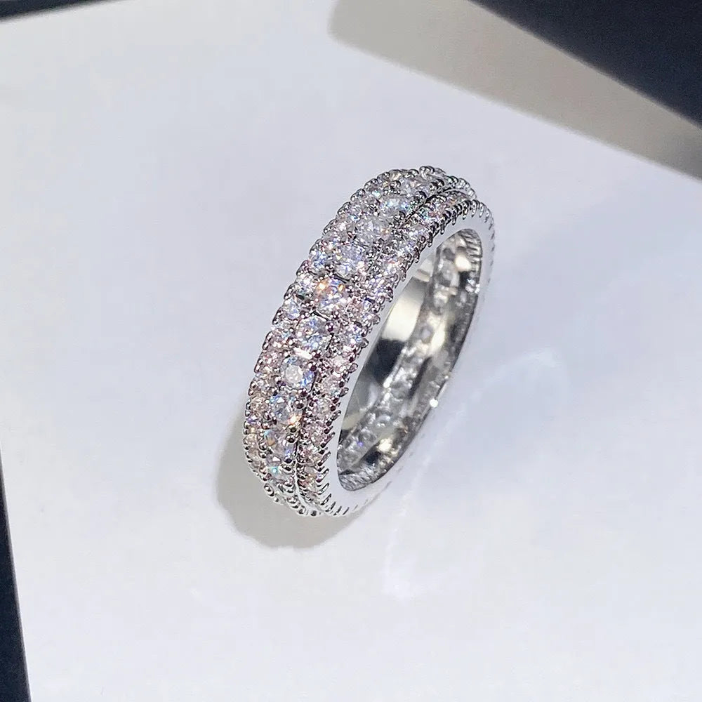 Geometric personalised ring with triangular design and zircon stone, shown in a gold colour finish.